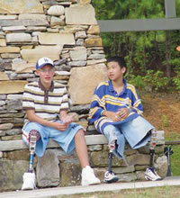 Man and young teen sitting