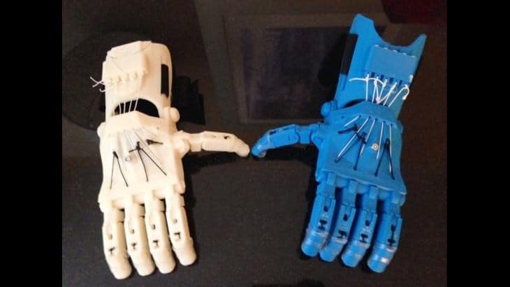 Two 3D printed biotic limbs in different colors, blue and white.
