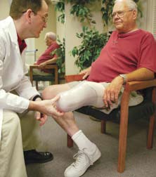 Lower limb amputee with doctor getting examined.